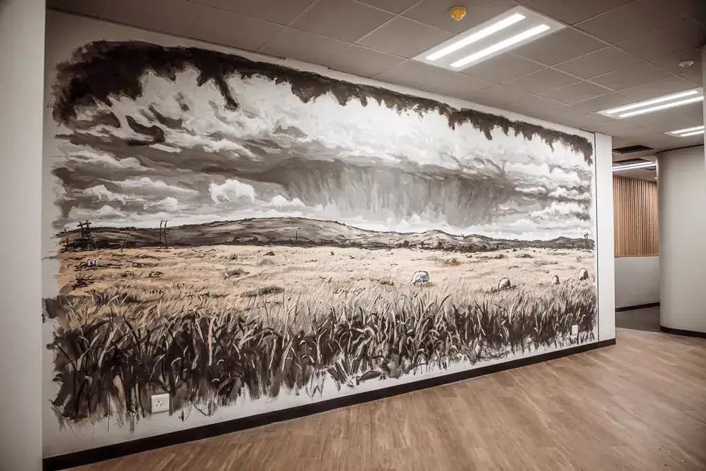 Hollard Phase 12: an office interior with the full height monochrome mural of a highveld landscape.